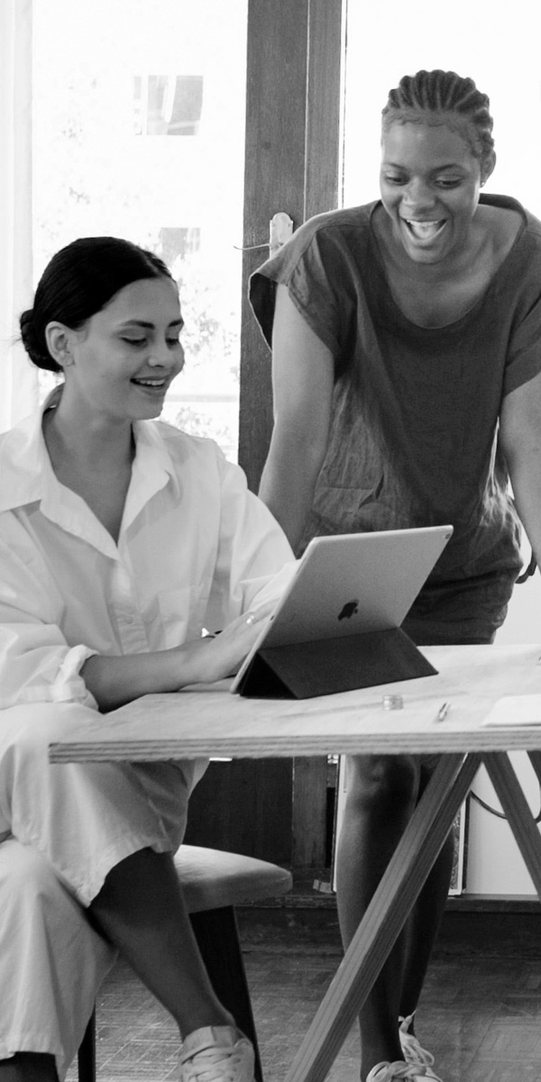 women working on ipad