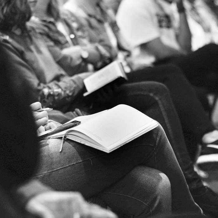 person taking notes during church service