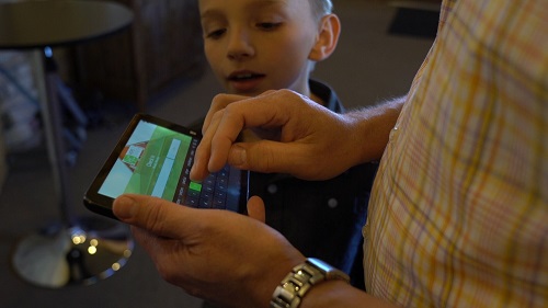 man and son checking into church