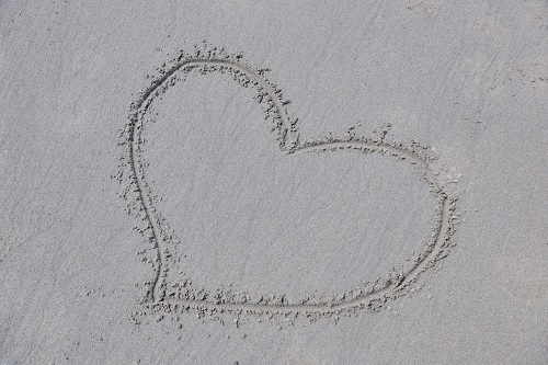 heart drawn in sand