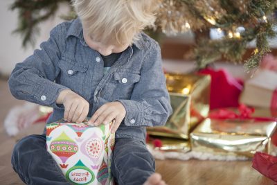 child opening christmas gift