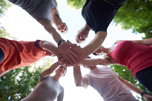 people stacking hands