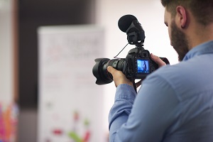 videographer recording on conference