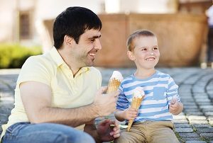 father and son eating ice cream