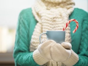 woman holding hot chocolate on christmas