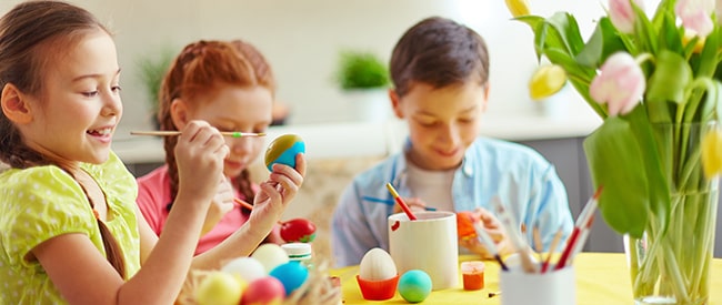 children coloring easter eggs