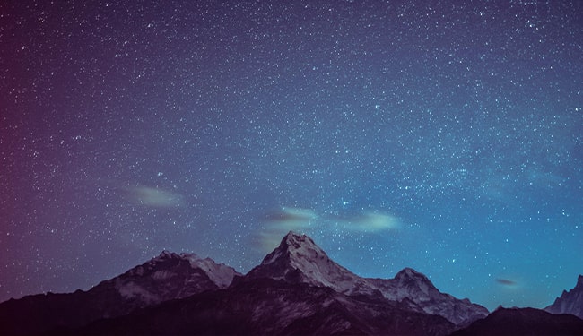 beautiful night sky with stars above mountains