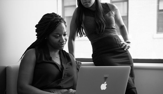 women working on computer