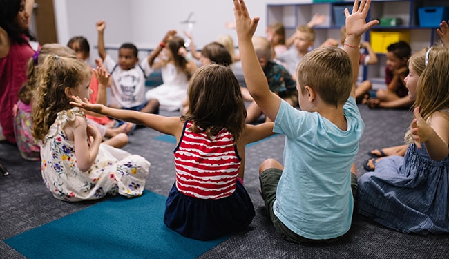 children sitting on floor