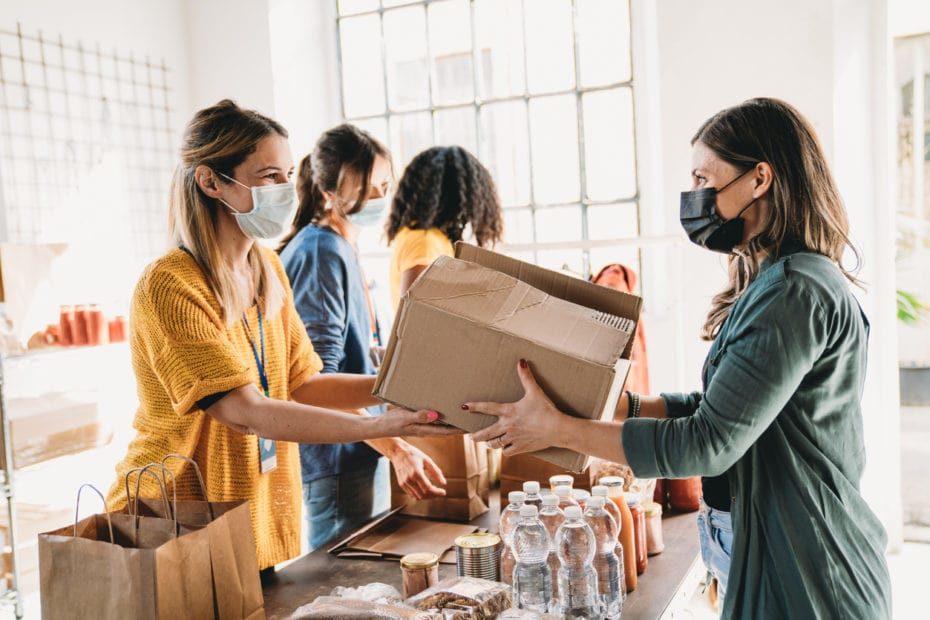 A group packages donations for a food bank.