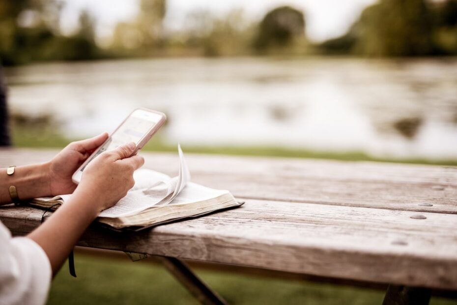 woman using bible app on phone