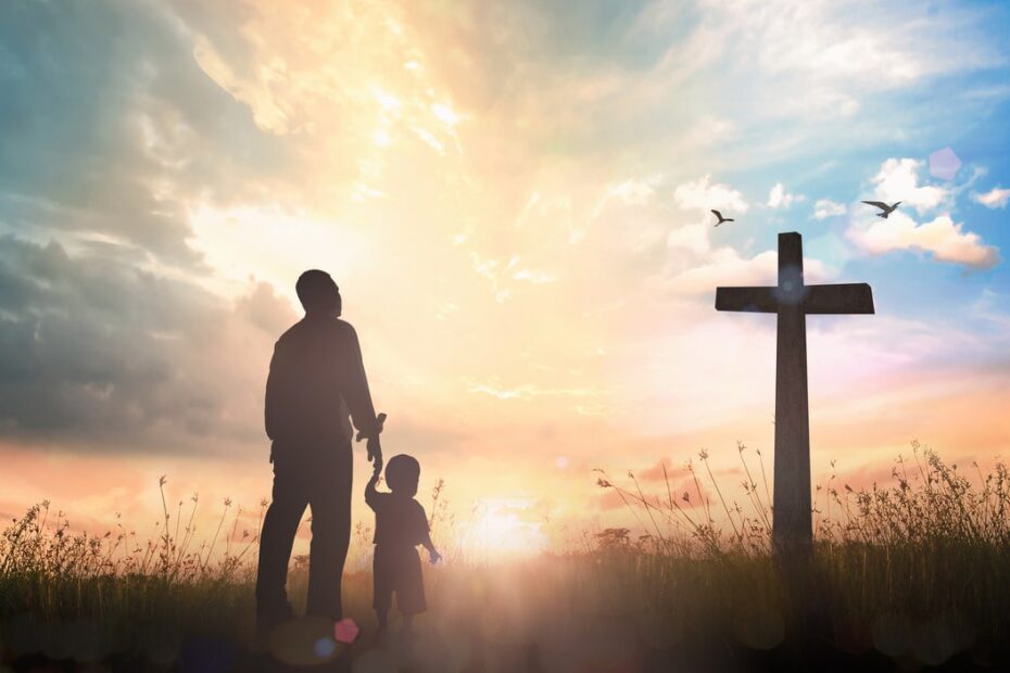 father and son visiting cross