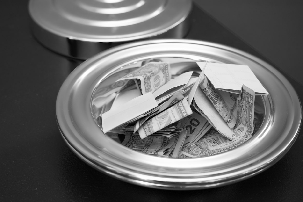 church donation plate filled with money