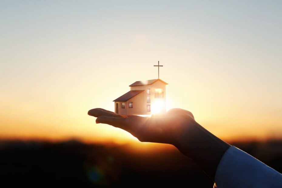 church in hand during sunset