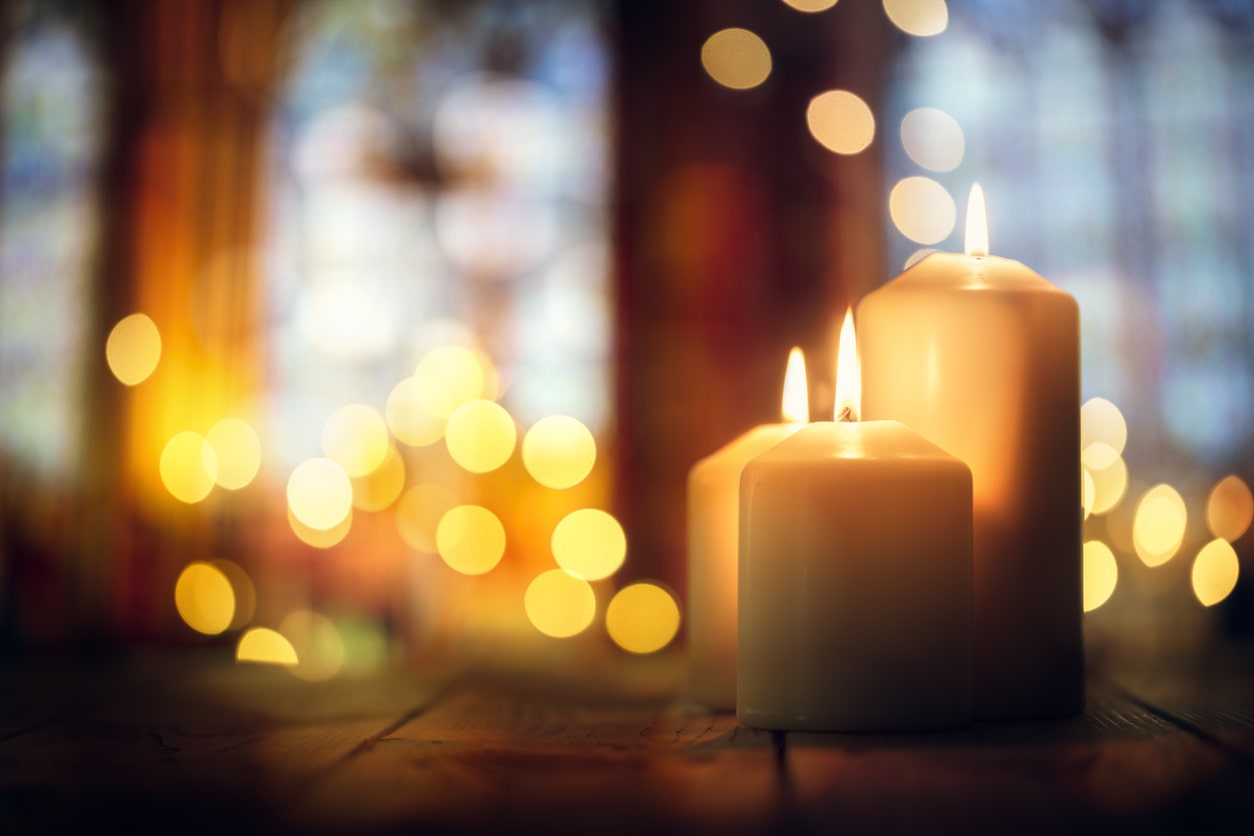 lit candles in church