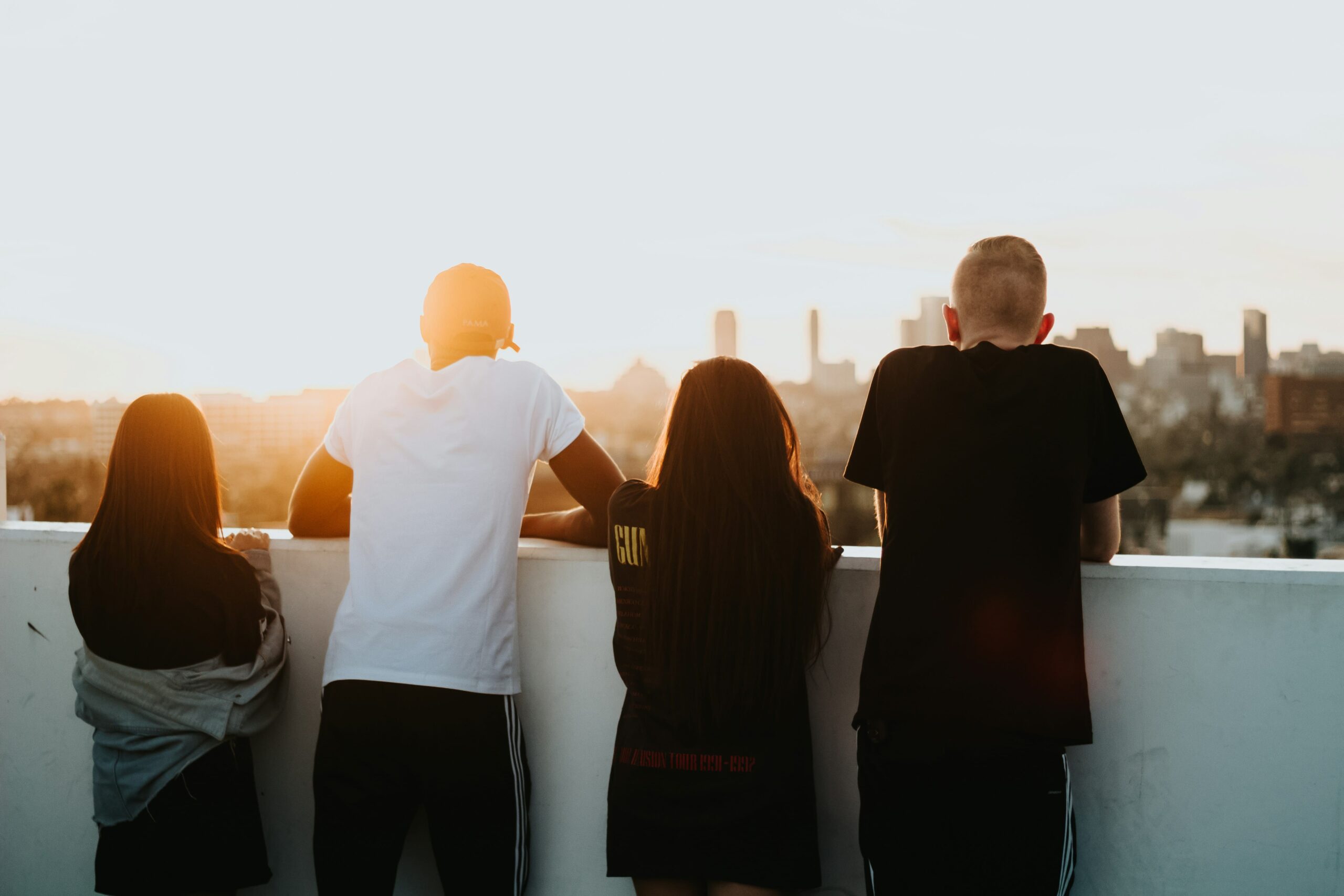 young adults staring at sunset