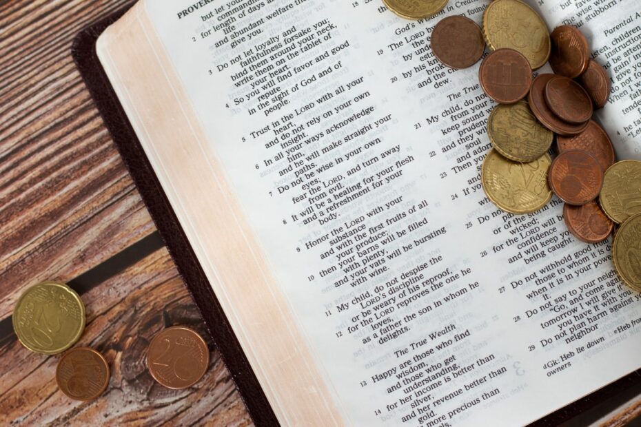 coins on top of bible versus about tithing