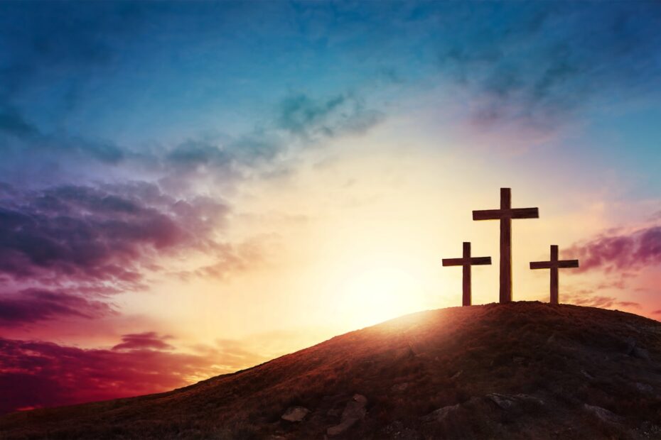 3 crosses on hill during the evening time