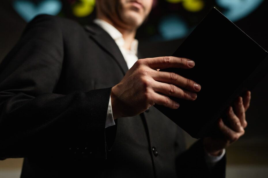 church leader holding bible