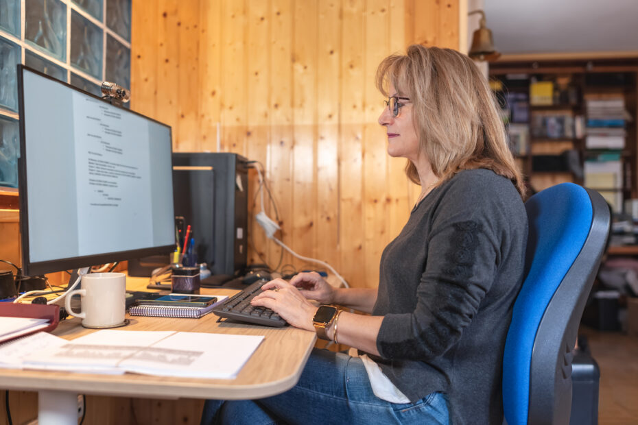Small church worker using accounting software on the computer