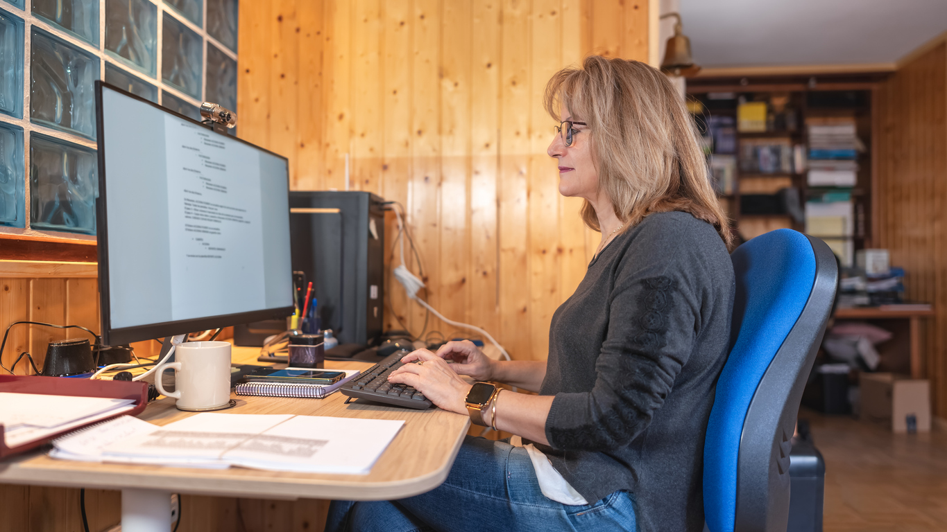 Small church worker using accounting software on the computer
