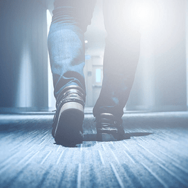 Person walking toward a door