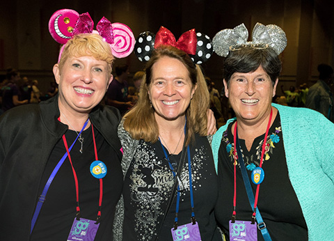 women wearing mickey mouse ears